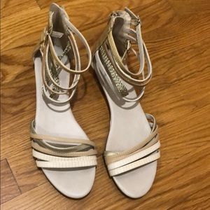 Also metallic gold multi zip back sandals